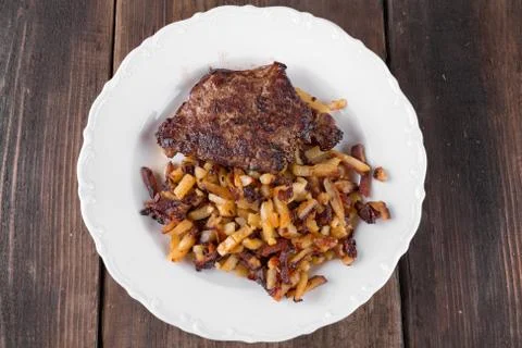 Bacon with fried potatoes Stock Photos