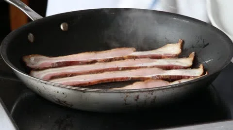 Bacon in frying pan Stock Footage 21528425
