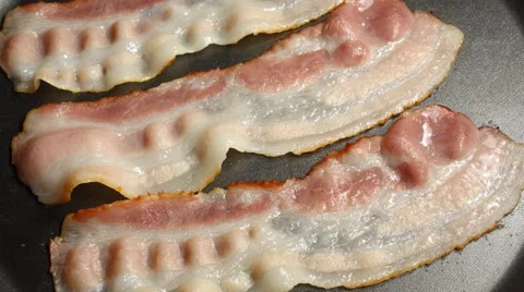 Bacon frying in a pan Stock-Footage 67895628