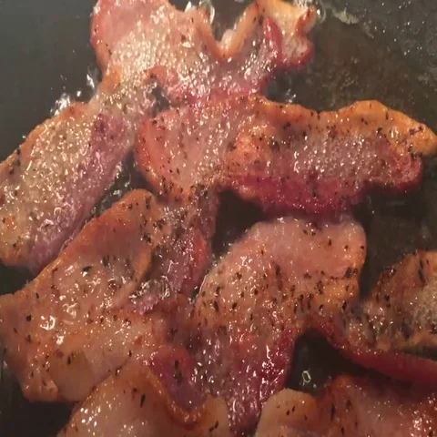 Bacon into the frying pan Stock Footage 69409015