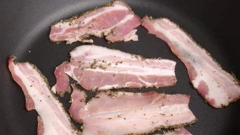 Bacon frying in a pan. Video stock 70878810