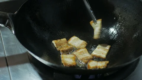 Bacon frying in a pan Stock Footage 96387984