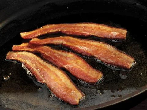 Bacon Frying in a Skillet Stock Photos