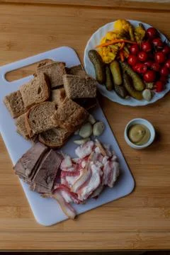 Bacon with garlic. Rye bread bacon garlic. Salted vegetables, pickled vegetab Stock Photos