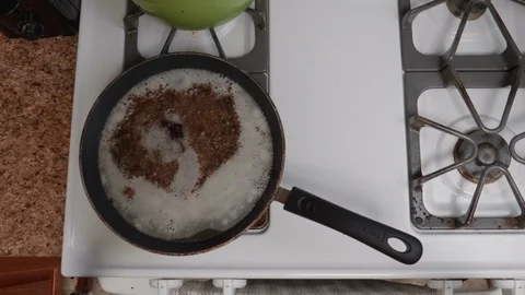 Bacon Grease Boiling and Bubling Stock Footage 86185107