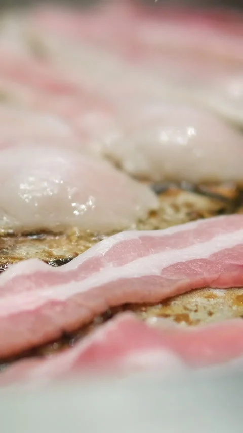 Bacon grilled on the grill for further burger preparation Stock Footage 302801436