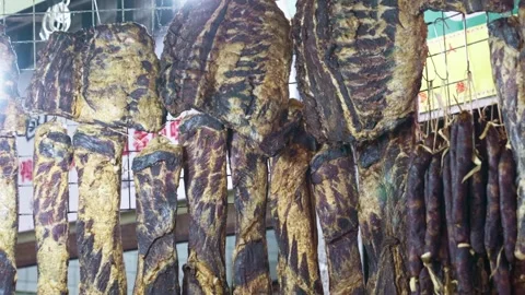 Bacon made from pork, cured meat hung up to dry, Chinese preserved pork Stock Footage 322776663
