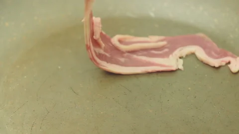 Bacon Of Marble Beef On The Red-hot Frying Pan Stock Footage 99610124