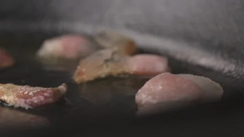 Bacon in pan, camera pans right to left Stock Footage 89936513