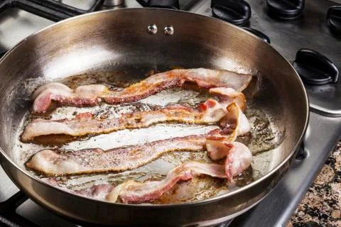 Bacon in the pan Stock Photos