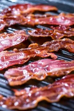 Bacon in a pan Stock Photos