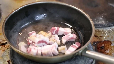 Bacon pieces are fried close-up Stock Footage 76082515