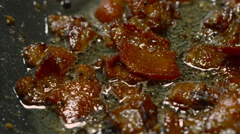 Bacon Pieces Frying in a Pan Stock Footage 68717461