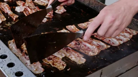 Bacon Rashers Cooking on the Griddle Plate of a Street Food Vendor Stock Footage 204923935