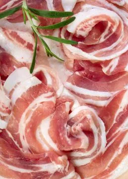 Bacon with rosemary leaf Stock Photos
