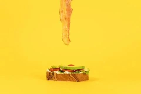 Bacon on sandwich bread. Stock Photos