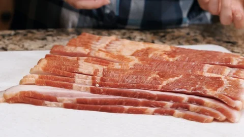 Bacon slices on the rotating board Stockbeeldmateriaal 102606166