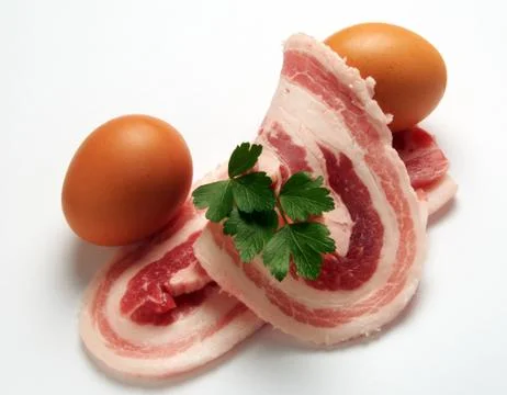 Bacon slices with two egg Stock Photos