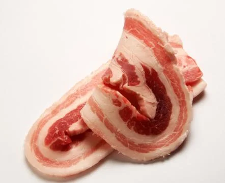 Bacon slices on white background Stock Photos