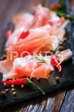 Bacon with spice on the black board Stock Photos