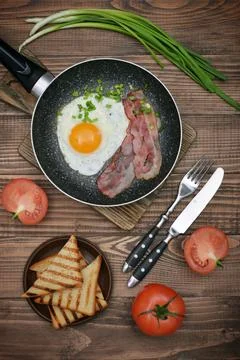 Bacon with sunny side up egg Stock Photos