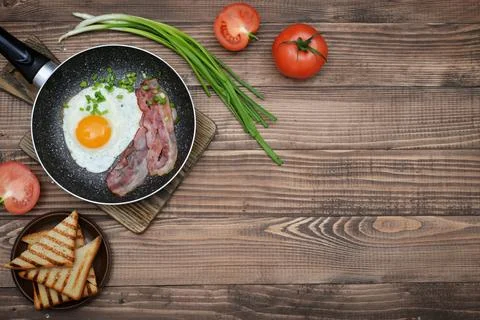 Bacon with sunny side up egg Stock Photos