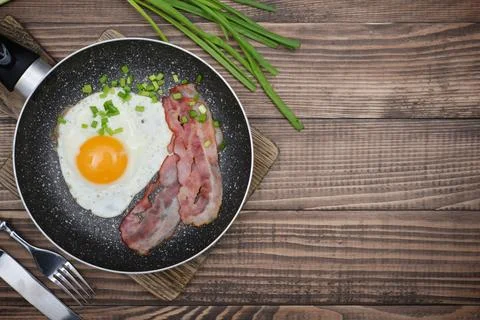 Bacon with sunny side up egg Stock Photos