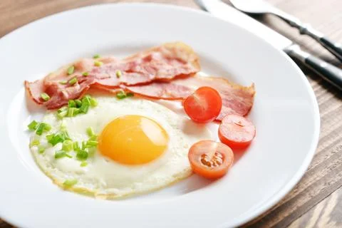 Bacon with sunny side up egg Stock Photos