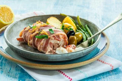 Bacon-wrapped haddock stuffed with crayfish tails Stock Photos