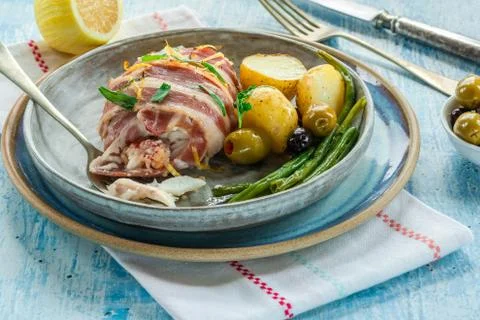 Bacon-wrapped haddock stuffed with crayfish tails Stock Photos