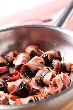 Bacon wrapped prunes Stock Photos