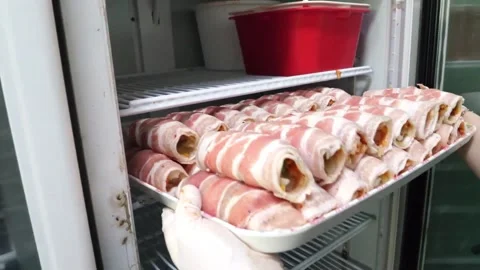 Bacon Wrapped Rolls Stacked on Tray Inside Commercial Refrigerator Video stock 343587987