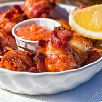 Bacon wrapped scallops Stock Photos