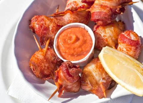 Bacon wrapped scallops Stock Photos