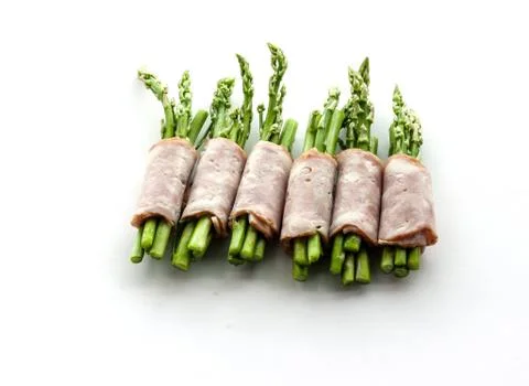 Bacon wrapping asparagus on isolate Stock Photos