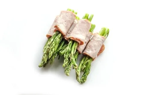 Bacon wrapping asparagus on isolate 写真素材