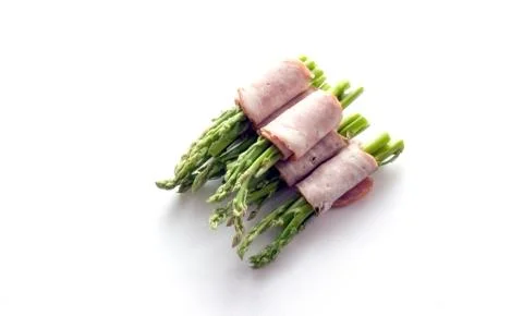 Bacon wrapping asparagus on isolate Stock Photos