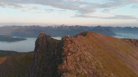 Bacwards drone shot of epic mountain against fjord. Stock Footage 219569627