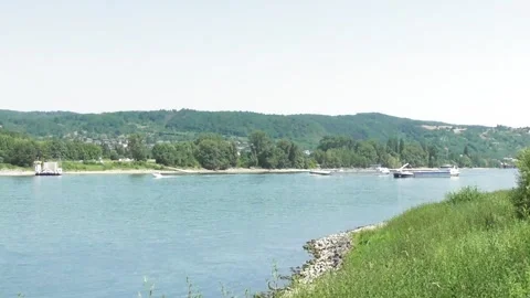 Bad Breisig, Germany - 06 24 2026: Cargo ship overtaking another Stock Footage 337667145
