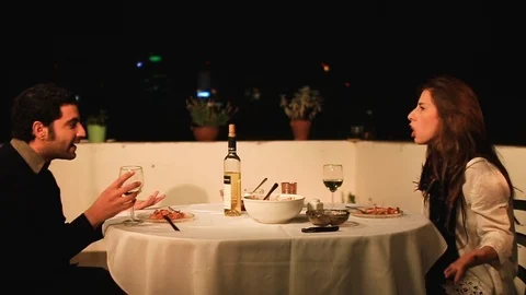 Bad date - couple yelling at each other during dinner Stock Footage 88987439