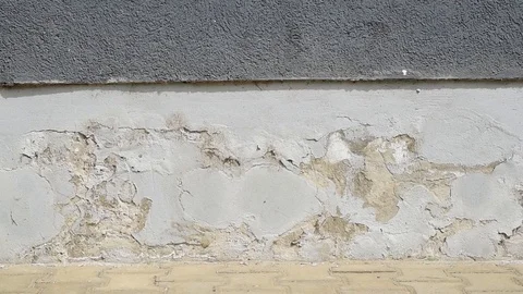 Bad foundation base on old house or building cracked plaster facade Stock Footage 106996596