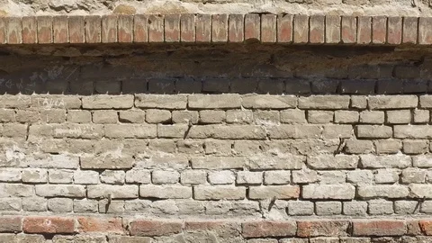 Bad foundations on old house cracked plaster facade wall with brick Stock Footage 110157644