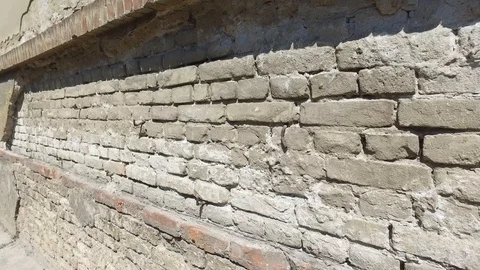 Bad foundations on old house cracked plaster facade wall with brick Stock Footage 110159508