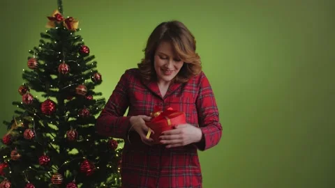 Bad gift. Disappointed expectations. Happy woman wearing red pajama, feels upset Stock-Footage 165685502