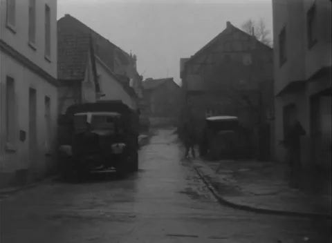 BAD GODESBERG, GERMANY - 1945: Pale window cloths - Armor fills narrow street Stock Footage 344488123