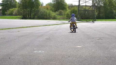 Bad Hersfeld, Germany, 04.21.25. First Bike Ride for Little Boy Stock Footage 308115606