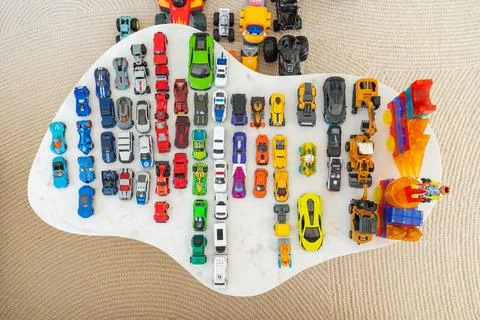 Bad Hersfeld, Germany, 05.05.25. Assorted Toy Cars Neatly Arranged on White Stock Photos