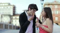 bad joke - girl spreads ice cream cone in the face of a boy - laughing HD Footage