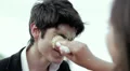 bad joke - girl spreads ice cream cone in the face of a boy - laughing HD Footage