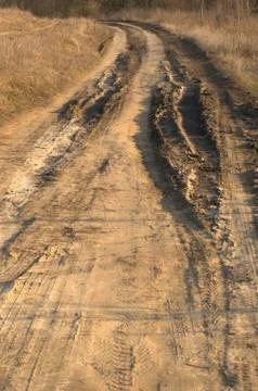 Bad muddy countriside road in spring Stock Photos